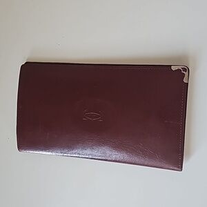 VINTAGE CARTIER LEATHER BI-FOLDCHECKBOOK WALLET, BURGUNDY
